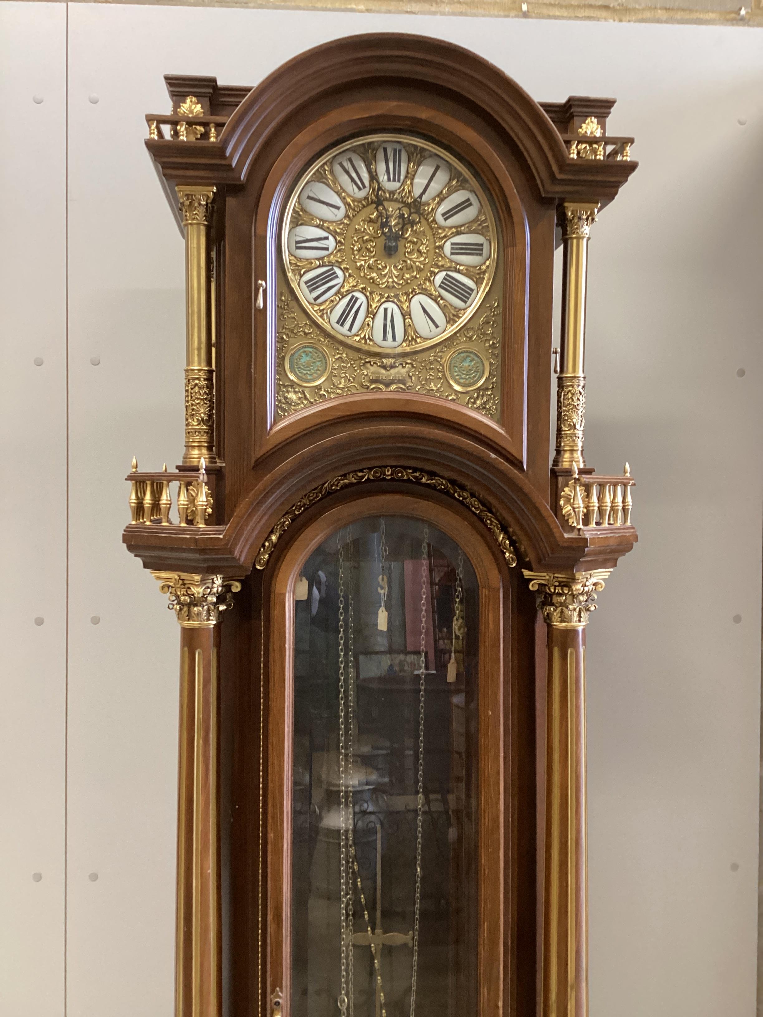 A mid 20th century Continental gilt metal mounted beech musical longcase clock, height 206cm